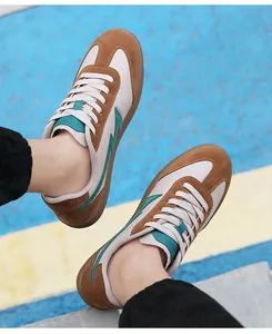 Close-up of retro leather sneakers featuring turquoise lightning accents on a rubber sole