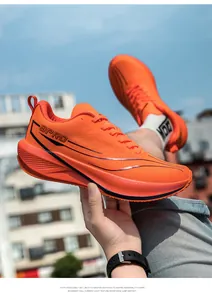 Macro shot of breathable orange mesh running shoes with 9PRO branding and cushioned sole