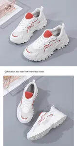 Dettaglio della sneaker platform con tessuto mesh bianco e accenti rossi per traspirabilità