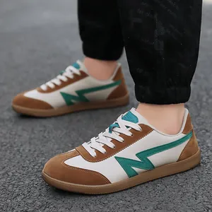 Retro low-top sneakers in white leather and brown suede with a green lightning logo