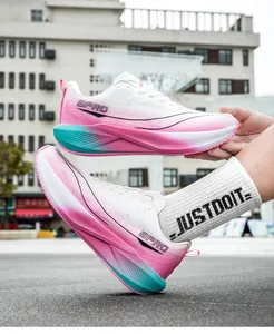 Macro detail of breathable white mesh and pink to cyan gradient midsole on the running shoe