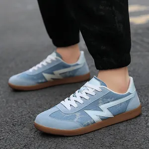 Men's retro low-top denim sneakers with blue lightning logo and gum sole on pavement