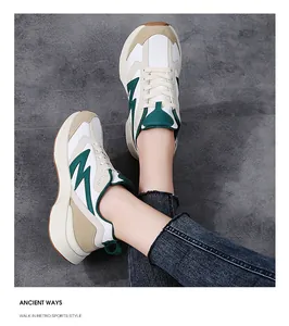 Detail shot of vintage chunky sneakers showing multi-material paneling and thick soles