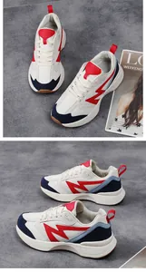Detail of color-block low-top platform sneakers with red lightning pattern and thick sole