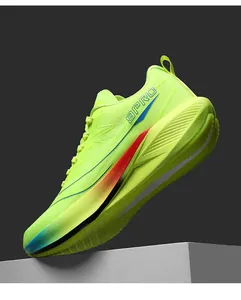 Close-up of fluorescent yellow mesh running shoes with 9PRO logo and cushioned soles