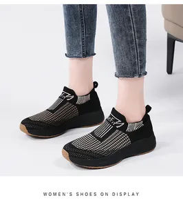 Detail showing the breathable black knit mesh upper and slip-on collar of women sneakers