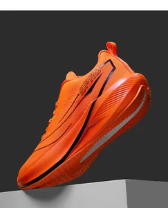 Detail view of the breathable mesh upper and 9PRO logo on professional orange running shoes
