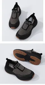 Detail view of black knit slip-on sneakers with beige texture and anti-slip rubber soles