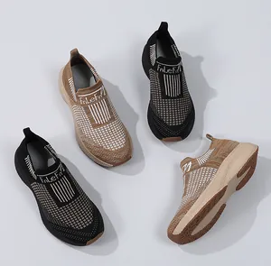 Detail of breathable knit mesh fabric and textured non-slip soles of casual sneakers
