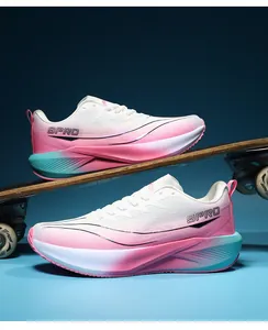 Detail of breathable mesh running shoes with pink gradient sole on a skateboard