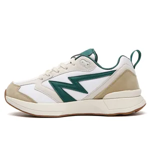 Retro low-top sneakers in white leather and green suede with a lightning bolt logo