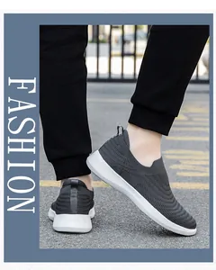 Outdoor walk showing grey slip-on knit walking shoe with white sole and textured mesh
