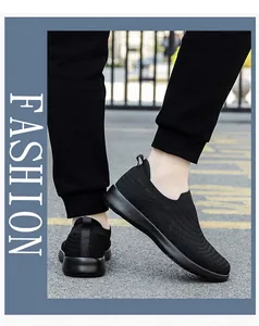Detail of black slip-on walking shoes featuring breathable mesh and flexible EVA sole