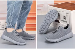 Detailed macro view of the grey breathable mesh upper and anti-slip rubber outsole texture