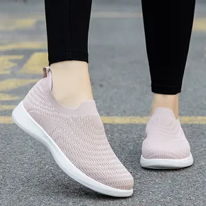 Pink slip-on walking shoes with breathable knit upper and white lightweight sole