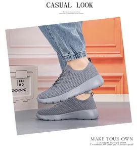 Side view of gray mesh breathable sneakers with thick soles and casual lace-up design
