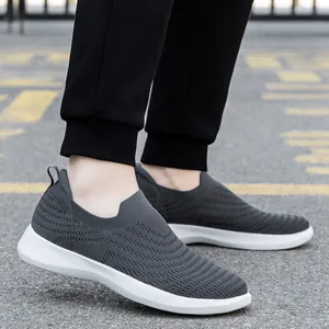 Breathable men's slip-on walking shoes in dark gray knit with lightweight white soles