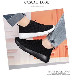 Detailed view of breathable black mesh sneakers with classic white and black sole options