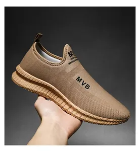 Detailed macro view of khaki breathable mesh fabric and MVB logo on men's slip-on sneaker