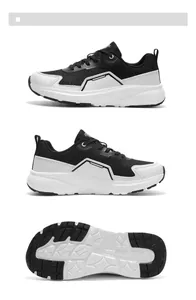 Detail view of black breathable mesh and white leather stitching on wide running shoes