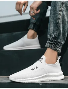 Close-up of men's white slip-on sneakers featuring breathable mesh and durable rubber soles