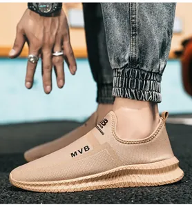 Detailed side view of khaki slip-on sneakers with breathable mesh and MVB lettering