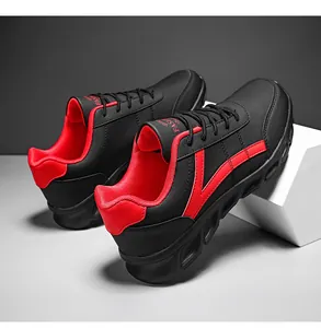 Dettaglio di sneaker da uomo leggere in nero e rosso con marchio alla moda