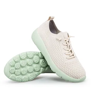 Breathable mesh knit sneakers in beige with non-slip green thick soles for casual sports