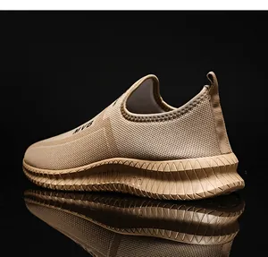 Detail showing breathable mesh upper and slip-on design of khaki men's sports sneakers