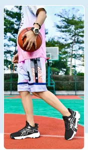 Outdoor action shot of pink gradient basketball jersey and shorts with pro shoes