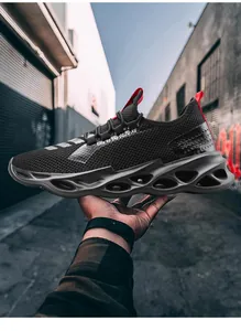 Detail of breathable mesh upper and hollow wavy sole on black men's sneakers