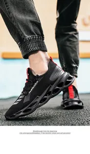 Close-up of men's mesh running shoe featuring a red pull tab and hollow cushioning sole