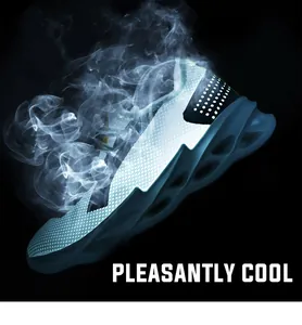 Detail of breathable mesh upper and hollow wavy sole on white sport running shoes