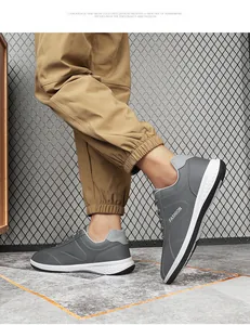 Grijze herensneakers van kunstleer met FASHION-logo en witte dempende zool