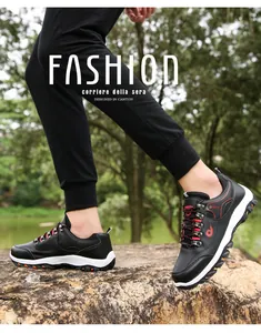 Outdoor shot of men's hiking shoes on rocks showing non-slip sole and side logo