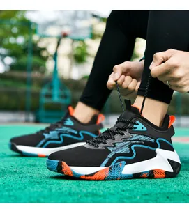 Detail of breathable knit basketball shoes with blue wave textures and rubber sole