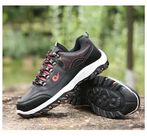 Outdoor hiking shoes with durable rubber soles and breathable upper shown on a rock