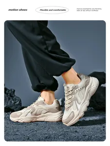 Dynamic low-angle view of breathable beige chunky sneakers for men with grippy sole