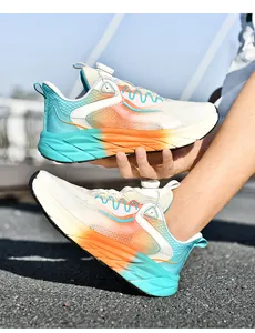 Detail of gradient athletic running shoe with quick-adjust rotary lace system