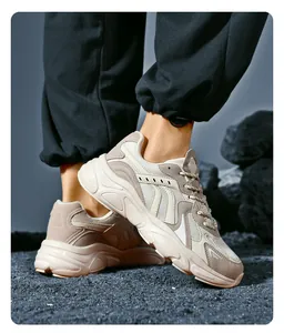Close-up of trendy chunky sneakers featuring breathable mesh and contrast knit laces