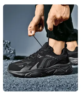 Close-up of black chunky sneakers featuring mesh layering and thick anti-slip soles