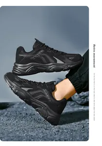 Close-up of all-black chunky sneakers with breathable mesh and retro thick anti-slip soles