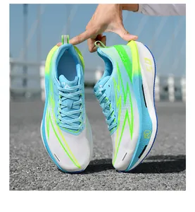 Detail of breathable mesh upper with neon green lightning patterns on cushioning running shoes