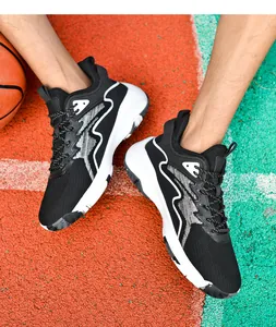 Action shot of high-top basketball shoes with mesh upper and thick cushioned soles