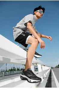 Low angle view of breathable mesh running shoes with thick cushioned soles and 5.0 marking