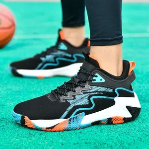 Men's breathable mesh basketball sneakers with blue rubber soles on a court