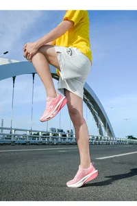 Pink cushioned running shoes featuring breathable mesh and thick soles for outdoor exercise