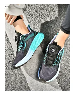 Detail of breathable running shoes featuring quick-adjust rotary lace knob on asphalt road