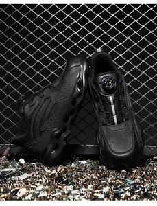 Detail of safety shoes with rotary buckle lacing and breathable mesh in industrial setting