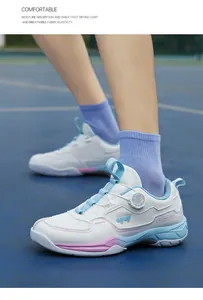 Detail of breathable mesh sports shoe with knob lacing system and gradient blue pink trim